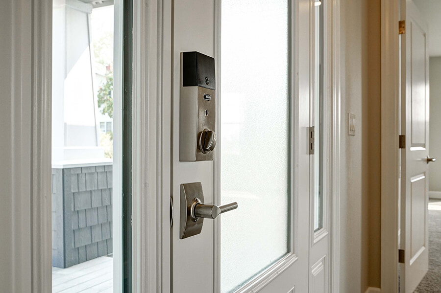 Photo of Contemporary Craftsman front door silver deadbolt and door handle