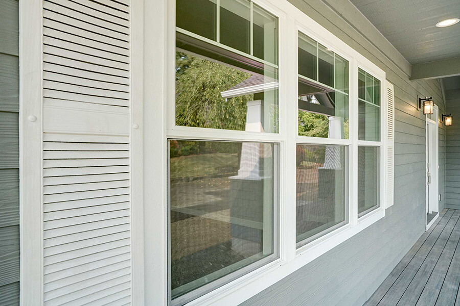 Photo of Contemporary Craftsman outside windows with white shutters and white molding