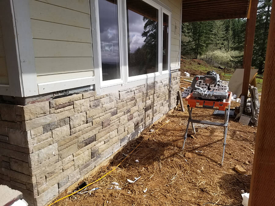 Photo of country retreat exterior brickwork in beige and tan brick