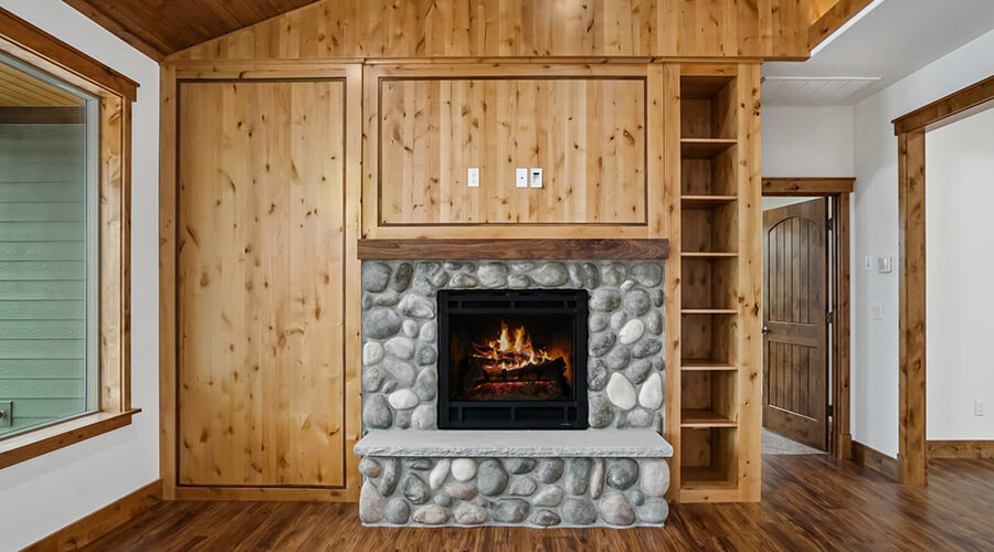 Refined River Cabin stone fireplace